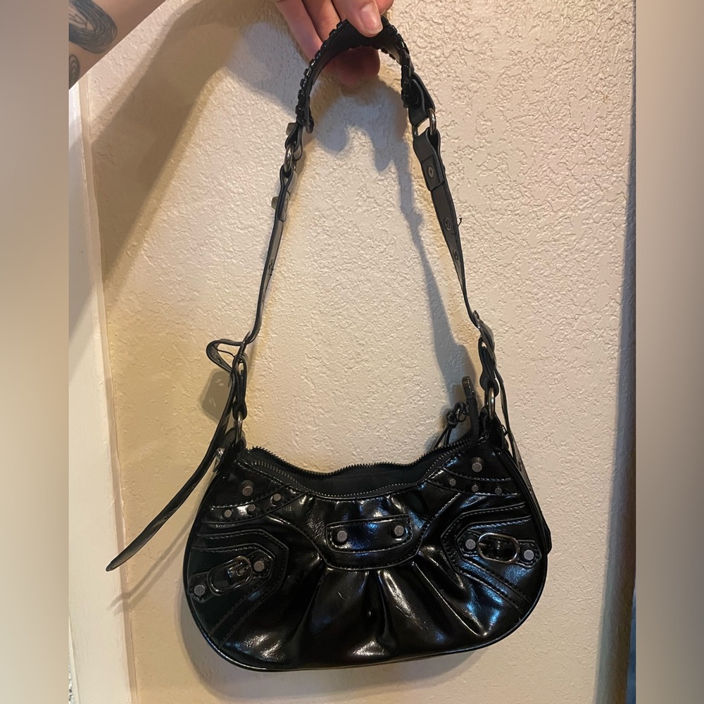 Black studded hand bag. Worn a few times but it is good as new!